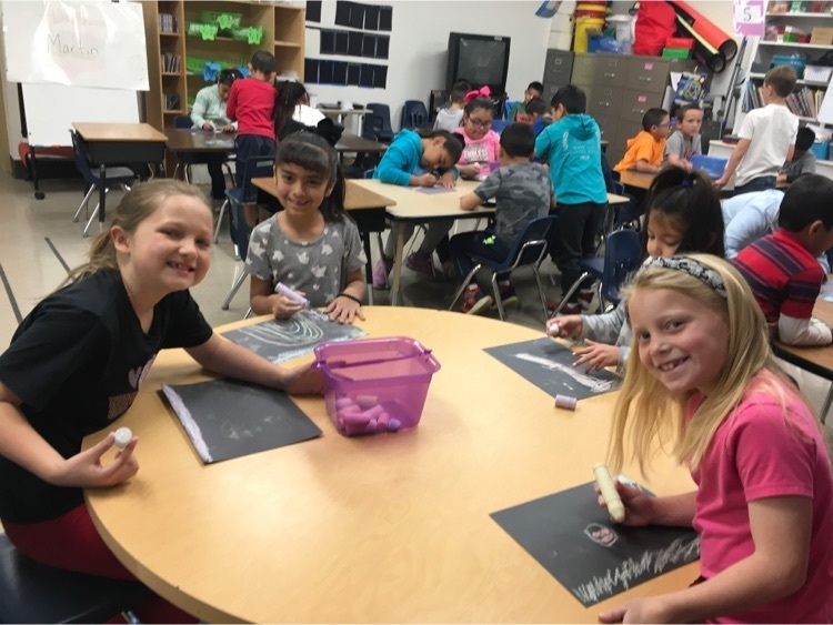 1st grade doing dynamic contrast art